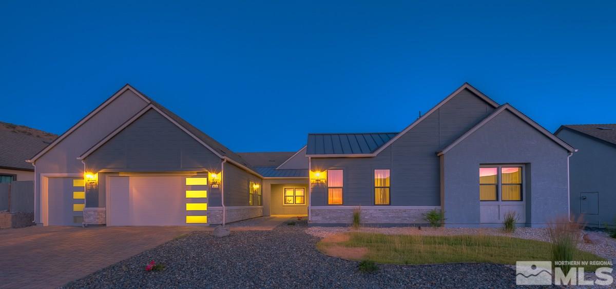 3018 Copper Stone Drive Reno, NV 89521 - Photo 28 of 29 a view of yellow house with a big yard and potted plants