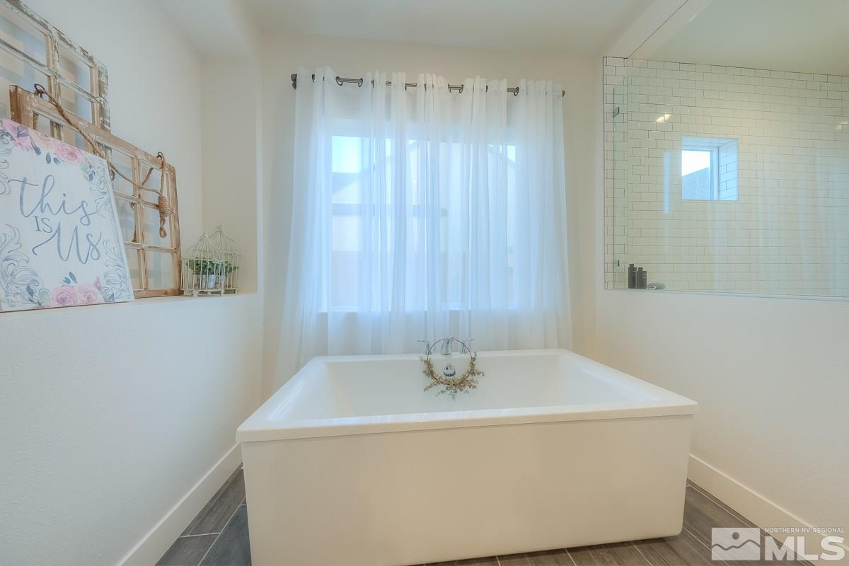 3018 Copper Stone Drive Reno, NV 89521 - Photo 4 of 29 a bathroom with a sink and a shower