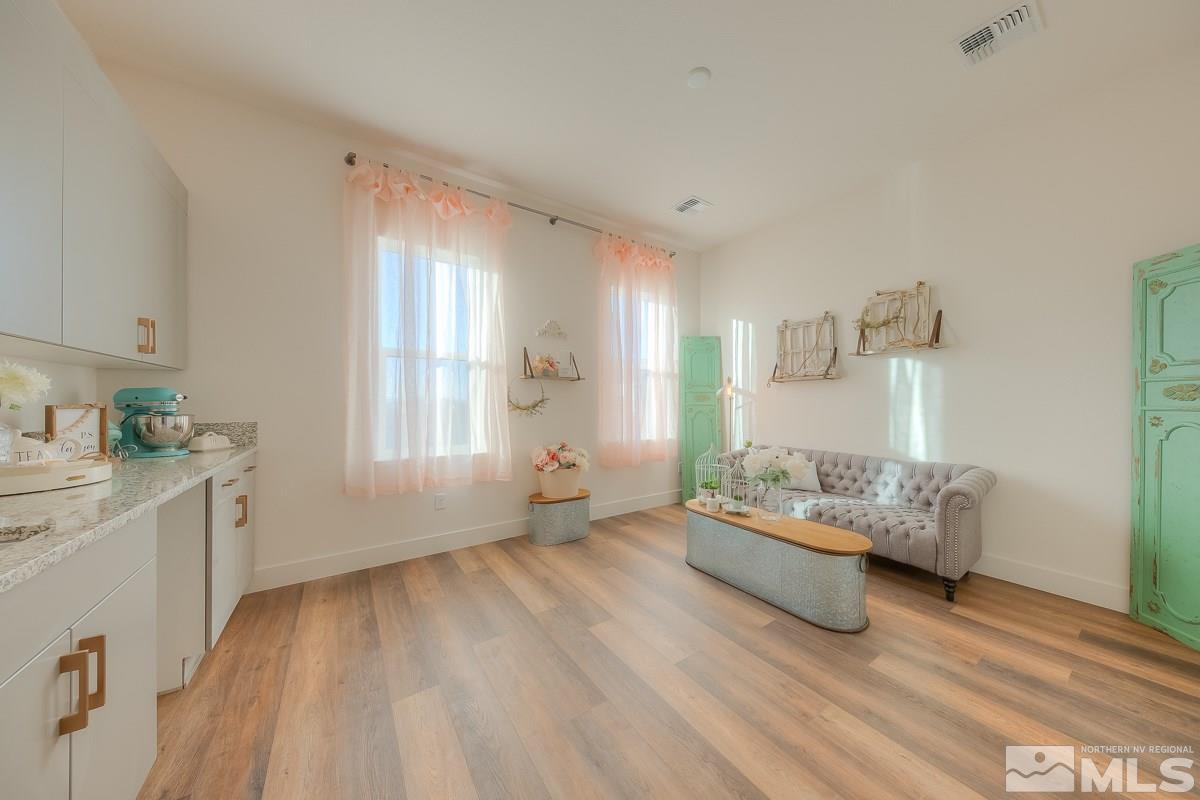 3018 Copper Stone Drive Reno, NV 89521 - Photo 7 of 29 a living room with furniture and a wooden floor