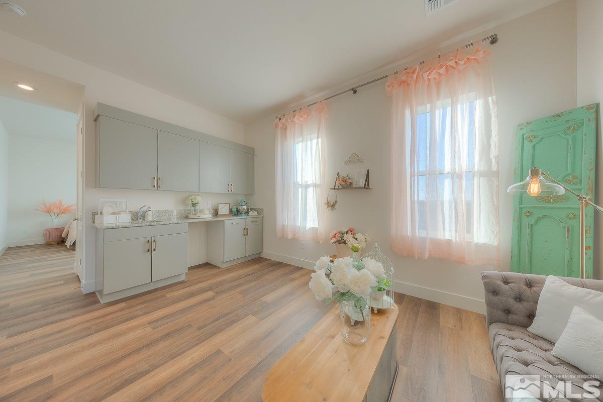 3018 Copper Stone Drive Reno, NV 89521 - Photo 9 of 29 a living room with furniture and wooden floor