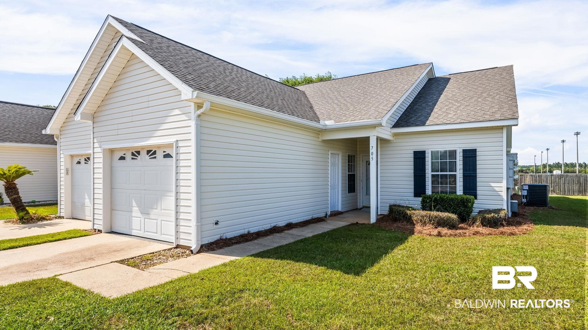 2651 South Juniper Street, Unit 705 Foley, AL 36535 - Photo 1 of 37 White siding exterior with a dark shingle roof