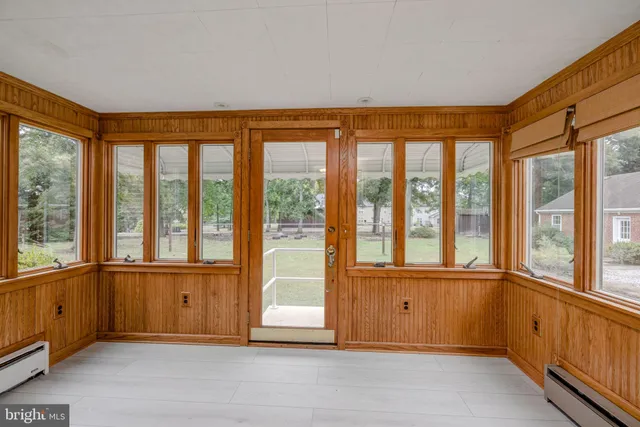 a view of an empty room with a large window