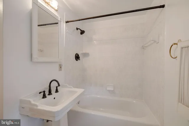 a view of an empty room with a fireplace