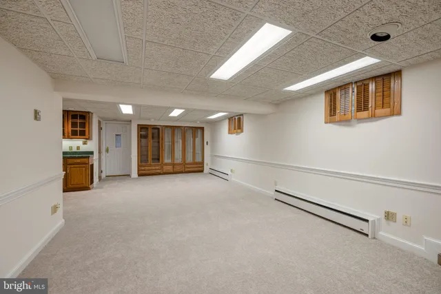 a view of an empty room with a fireplace