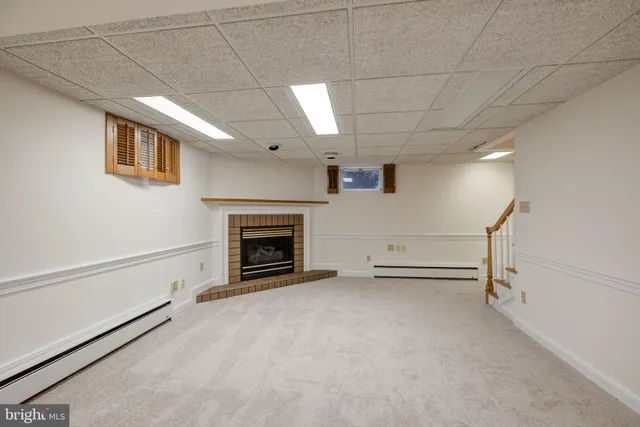 a view of an empty room with a kitchen