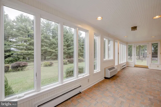 a view of an empty room with a large window