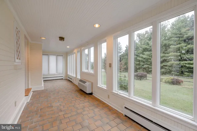 a view of a room with large windows