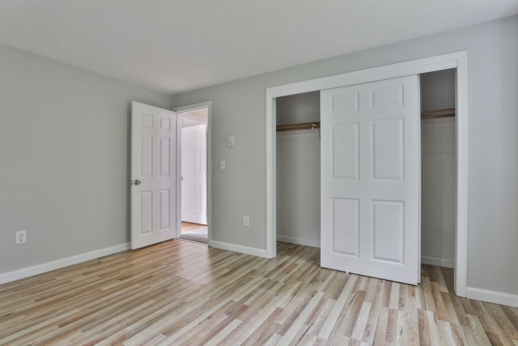 12 Al Derry Nh 03038, Unit R Derry, NH 03038 - Photo 17 of 23 a view of an empty room and wooden floor