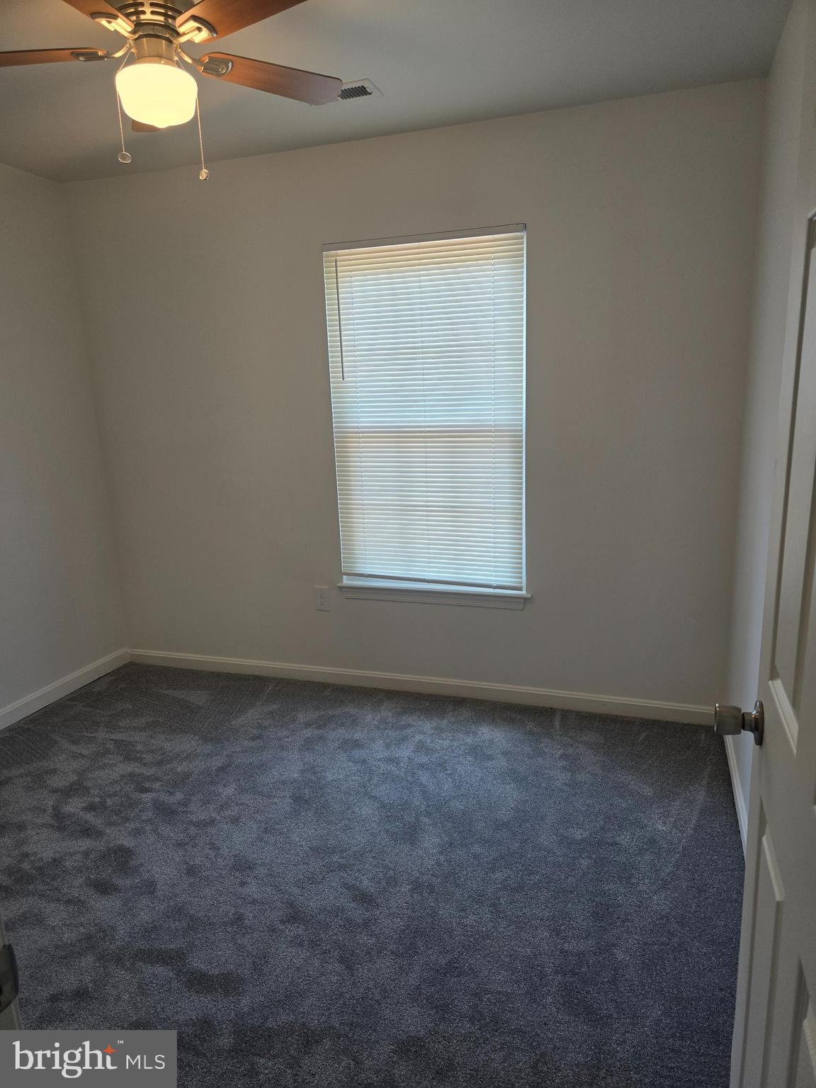 8839 Ritchboro Road District Heights, MD 20747 - Photo 9 of 12 an empty room with a window
