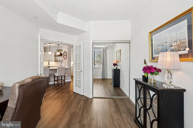 a view of an entryway with wooden floor
