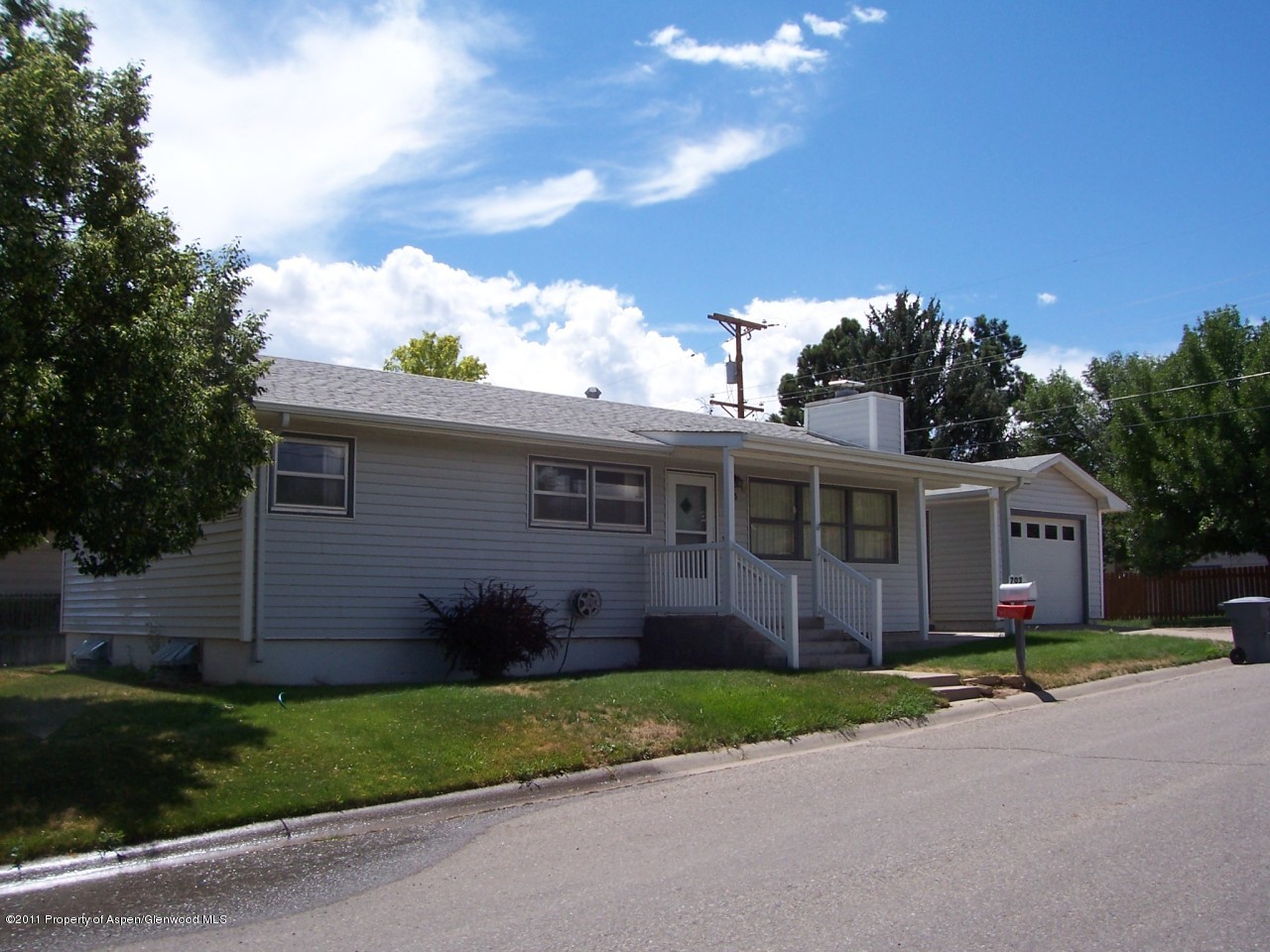 703 West 3rd Street Rifle, CO 81650 - Photo 1 of 22 a view of a house with a yard