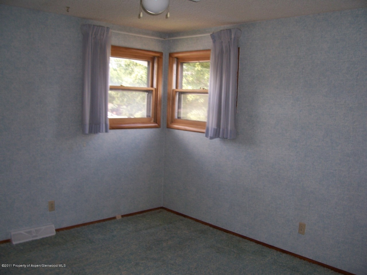 703 West 3rd Street Rifle, CO 81650 - Photo 11 of 22 an empty room with a window