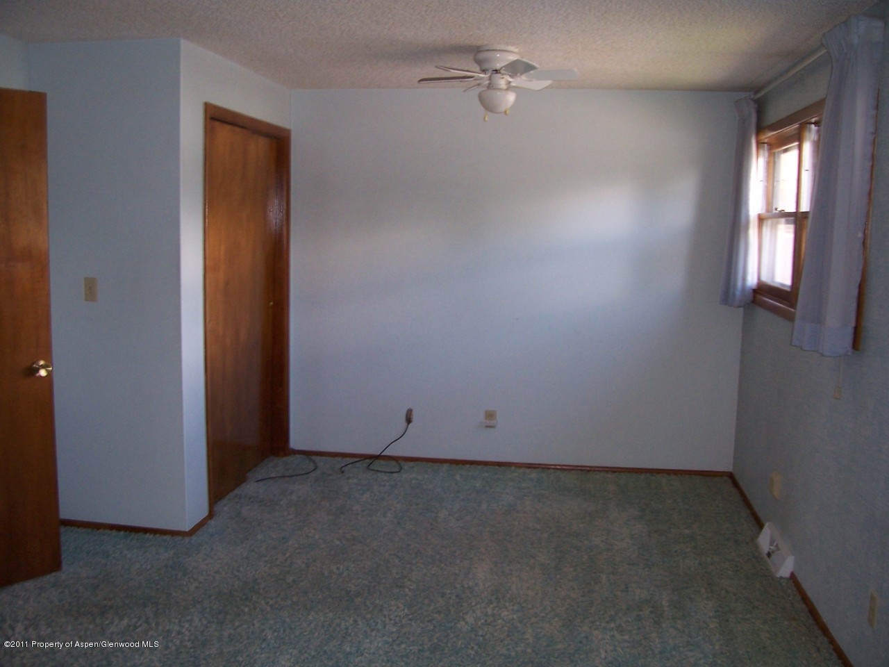 703 West 3rd Street Rifle, CO 81650 - Photo 12 of 22 an empty room with a window