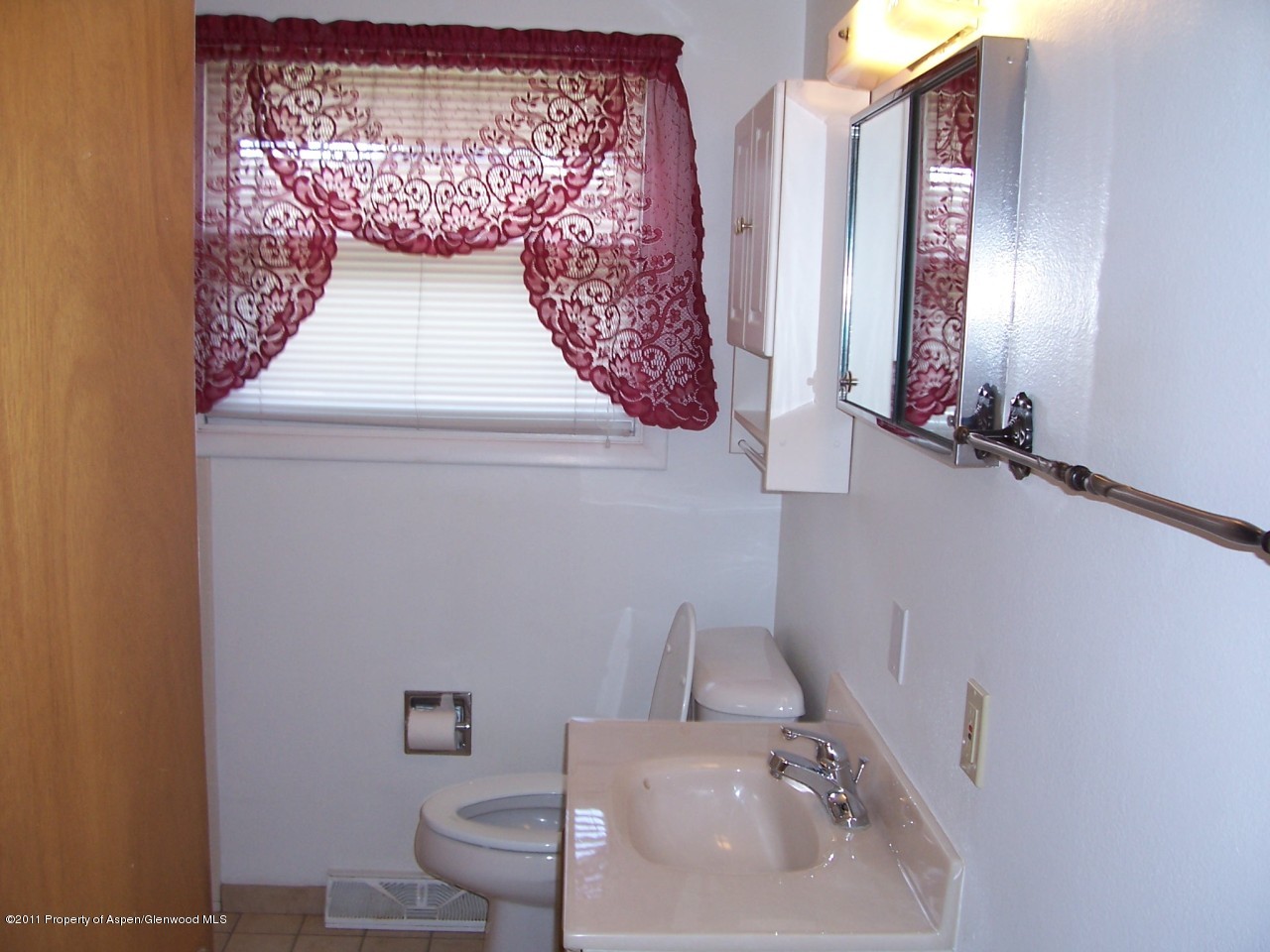 703 West 3rd Street Rifle, CO 81650 - Photo 13 of 22 a bathroom with a sink and a mirror