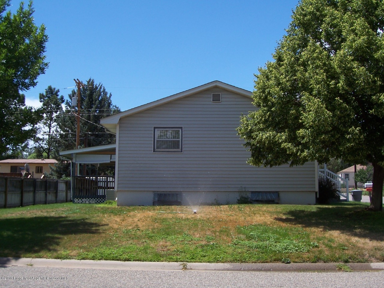 703 West 3rd Street Rifle, CO 81650 - Photo 19 of 22 a view of a house with a yard