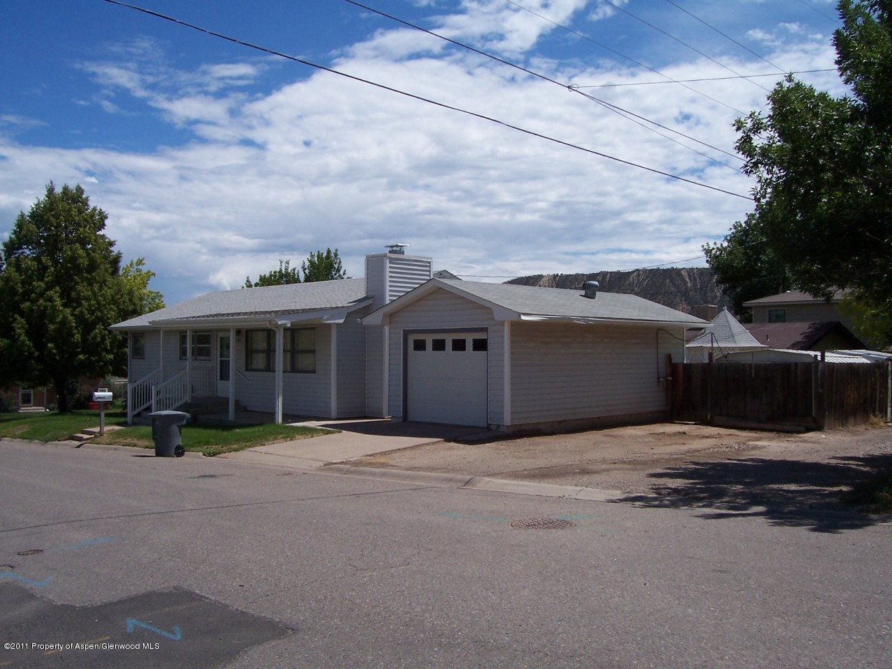 703 West 3rd Street Rifle, CO 81650 - Photo 3 of 22 a view of a house with a patio