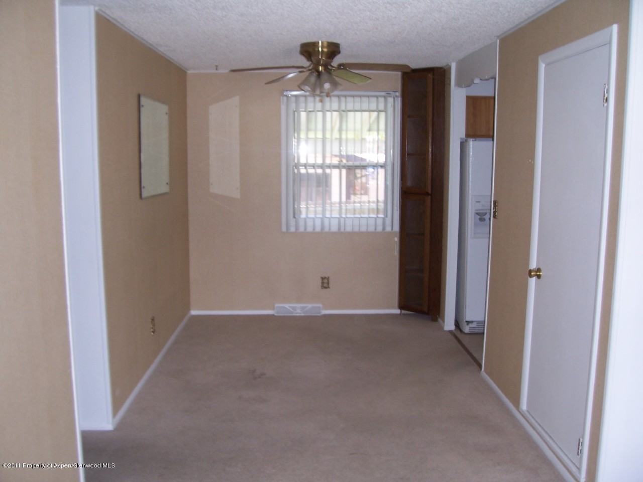 703 West 3rd Street Rifle, CO 81650 - Photo 5 of 22 a view of an empty room with a window