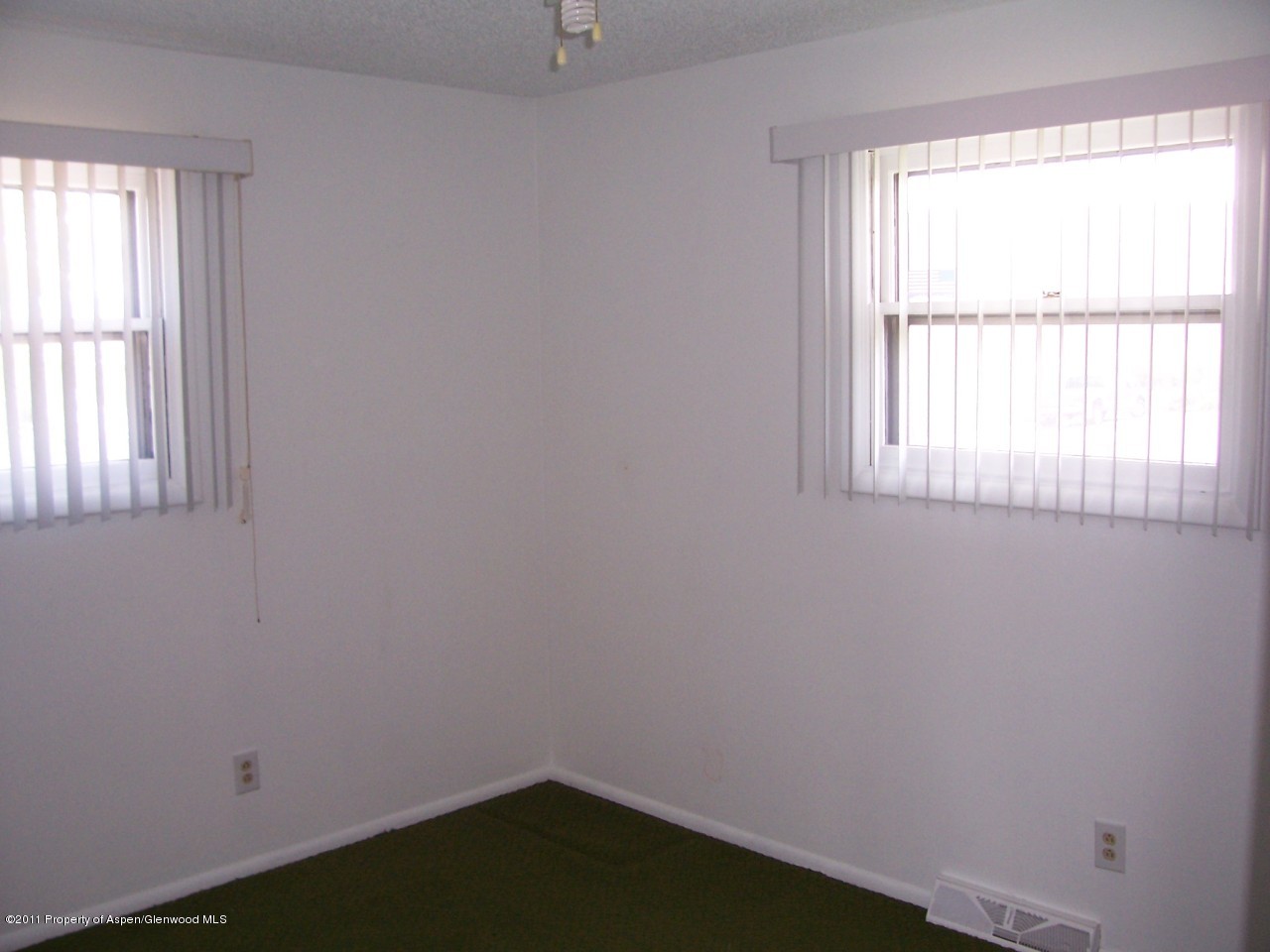 703 West 3rd Street Rifle, CO 81650 - Photo 9 of 22 an empty room with a window