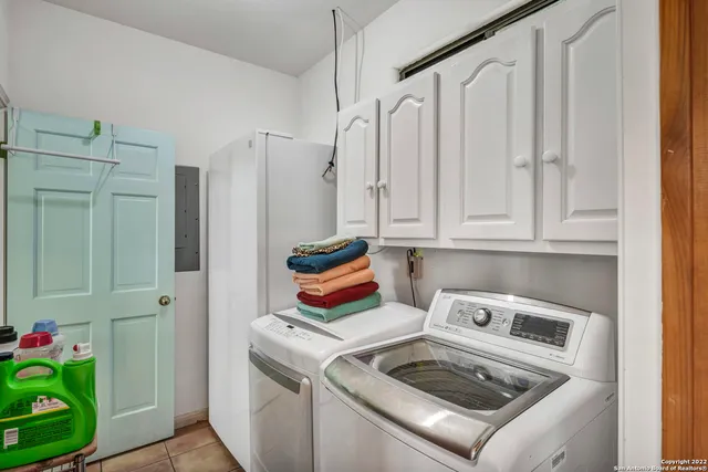 a view of a field with an trees