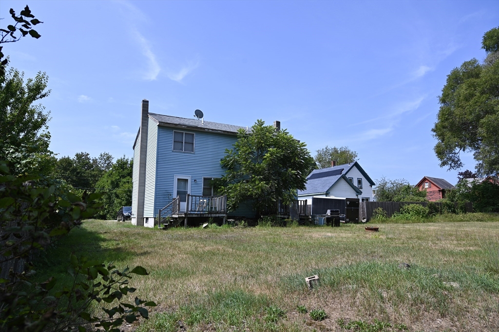 4 Spring Street Rochester, NH 03868 - Photo 11 of 29 a front view of a house with a yard