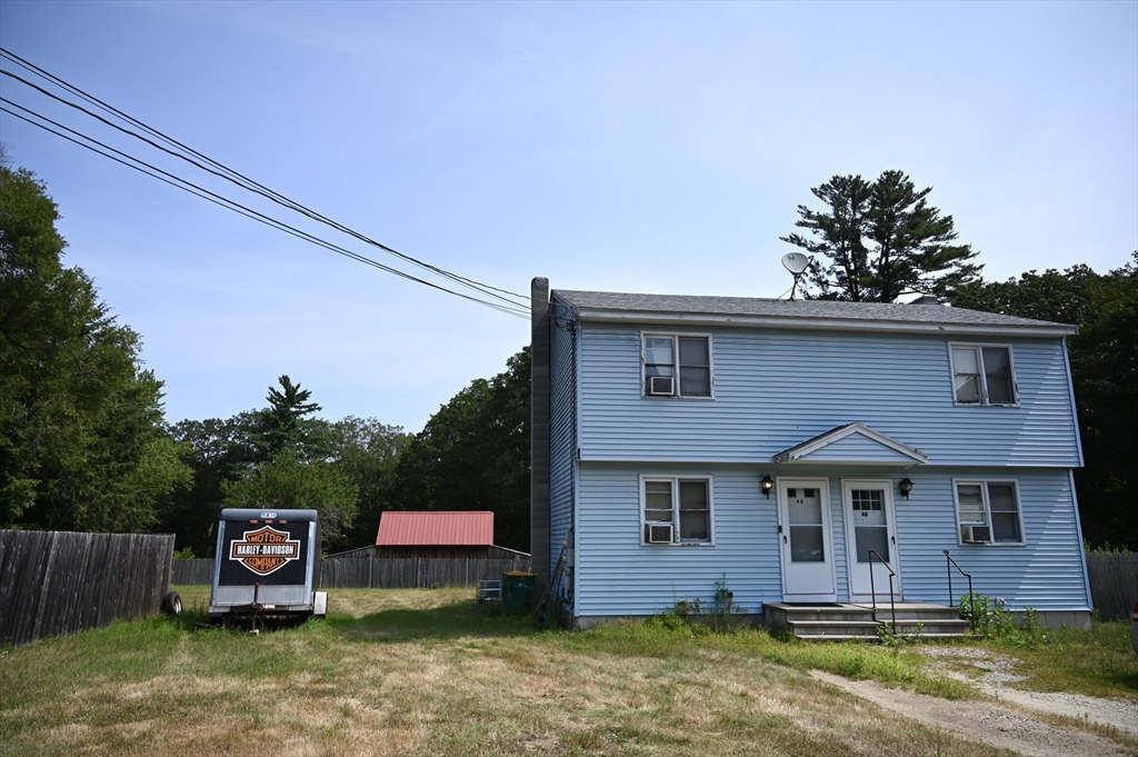 4 Spring Street Rochester, NH 03868 - Photo 14 of 29 a front view of a house with a garden