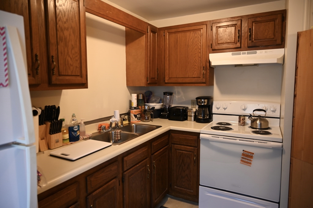 4 Spring Street Rochester, NH 03868 - Photo 20 of 29 a kitchen with sink cabinets and appliances