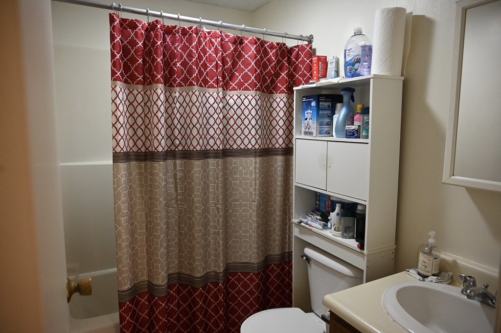4 Spring Street Rochester, NH 03868 - Photo 23 of 29 a bathroom with a sink and a toilet