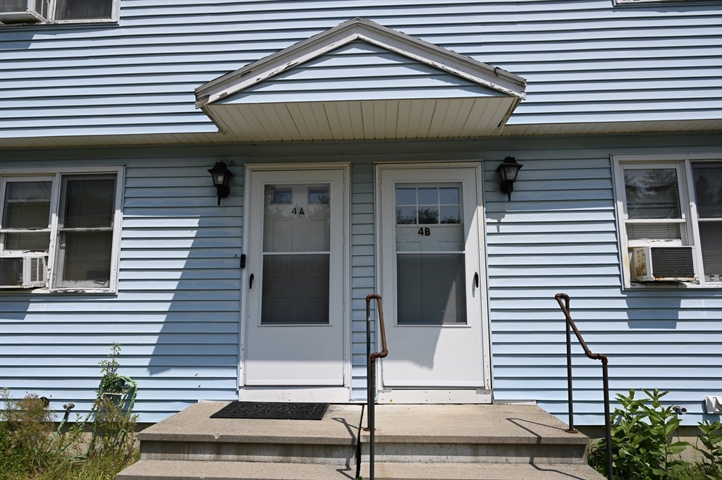 4 Spring Street Rochester, NH 03868 - Photo 27 of 29 a front view of a house with a garage