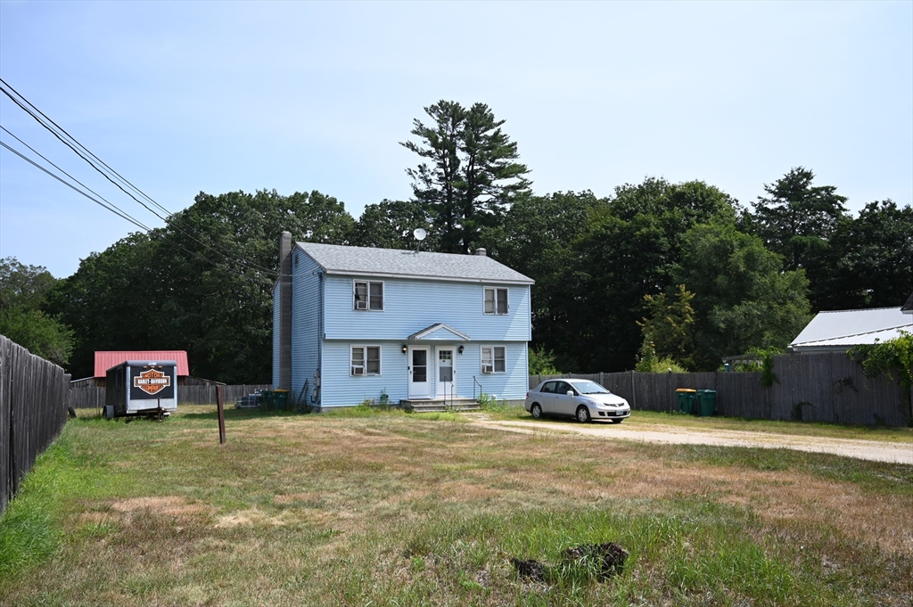4 Spring Street Rochester, NH 03868 - Photo 4 of 29 a car parked in front of house