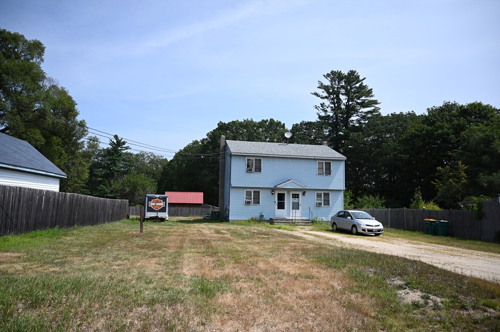 4 Spring Street Rochester, NH 03868 - Photo 5 of 29 a house view with a sitting space and garden
