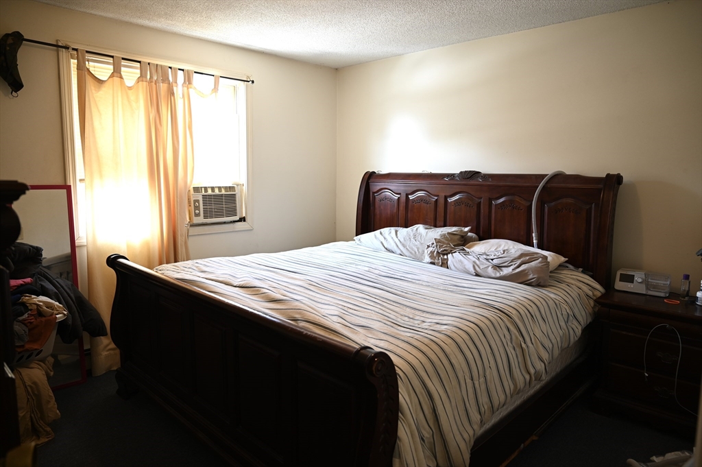 4 Spring Street Rochester, NH 03868 - Photo 7 of 29 a bedroom with a bed and a window