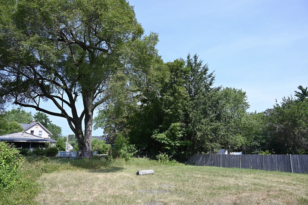 4 Spring Street Rochester, NH 03868 - Photo 8 of 29 a front view of a house with a yard