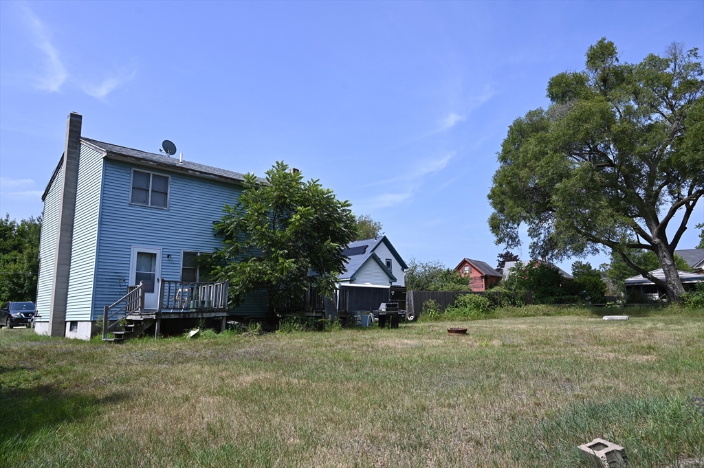 4 Spring Street Rochester, NH 03868 - Photo 10 of 29 a front view of house with yard and green space