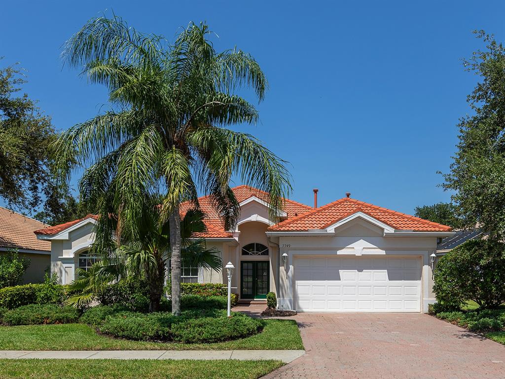 7749 US Open Loop Lakewood Ranch, FL 34202 - Photo 1 of 1 a front view of a house with a yard and garage
