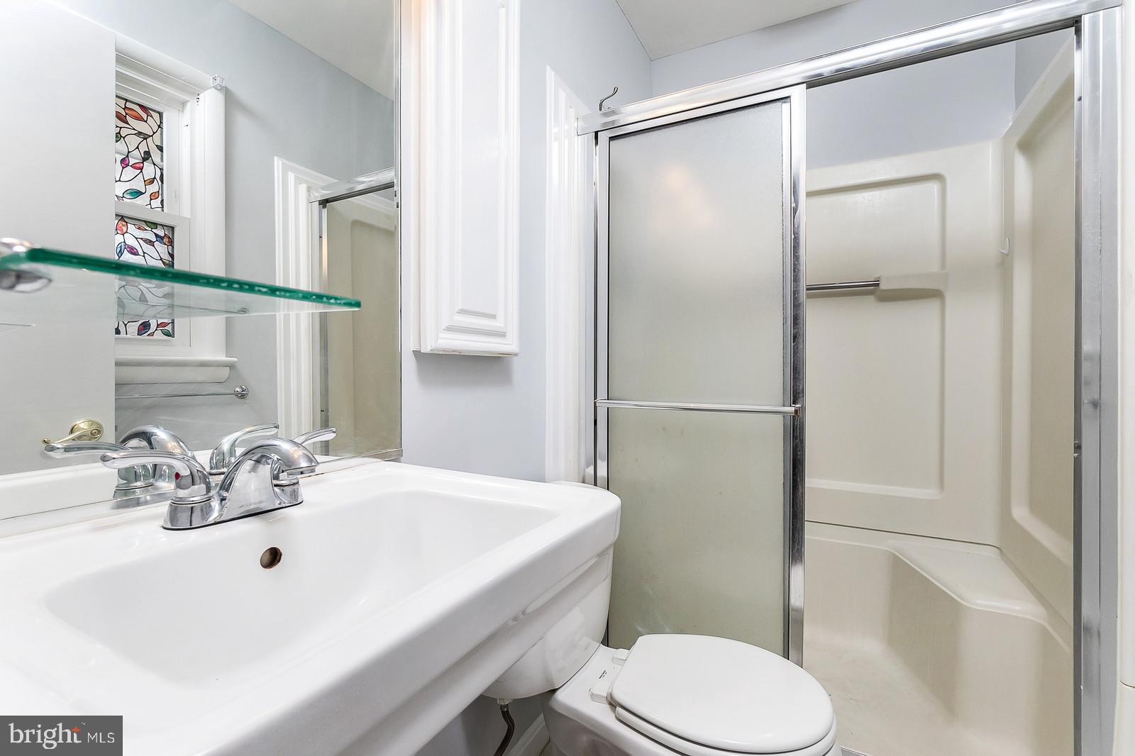 409 Orleans Circle Southwest Vienna, VA 22180 - Photo 12 of 23 a bathroom with a sink toilet and shower