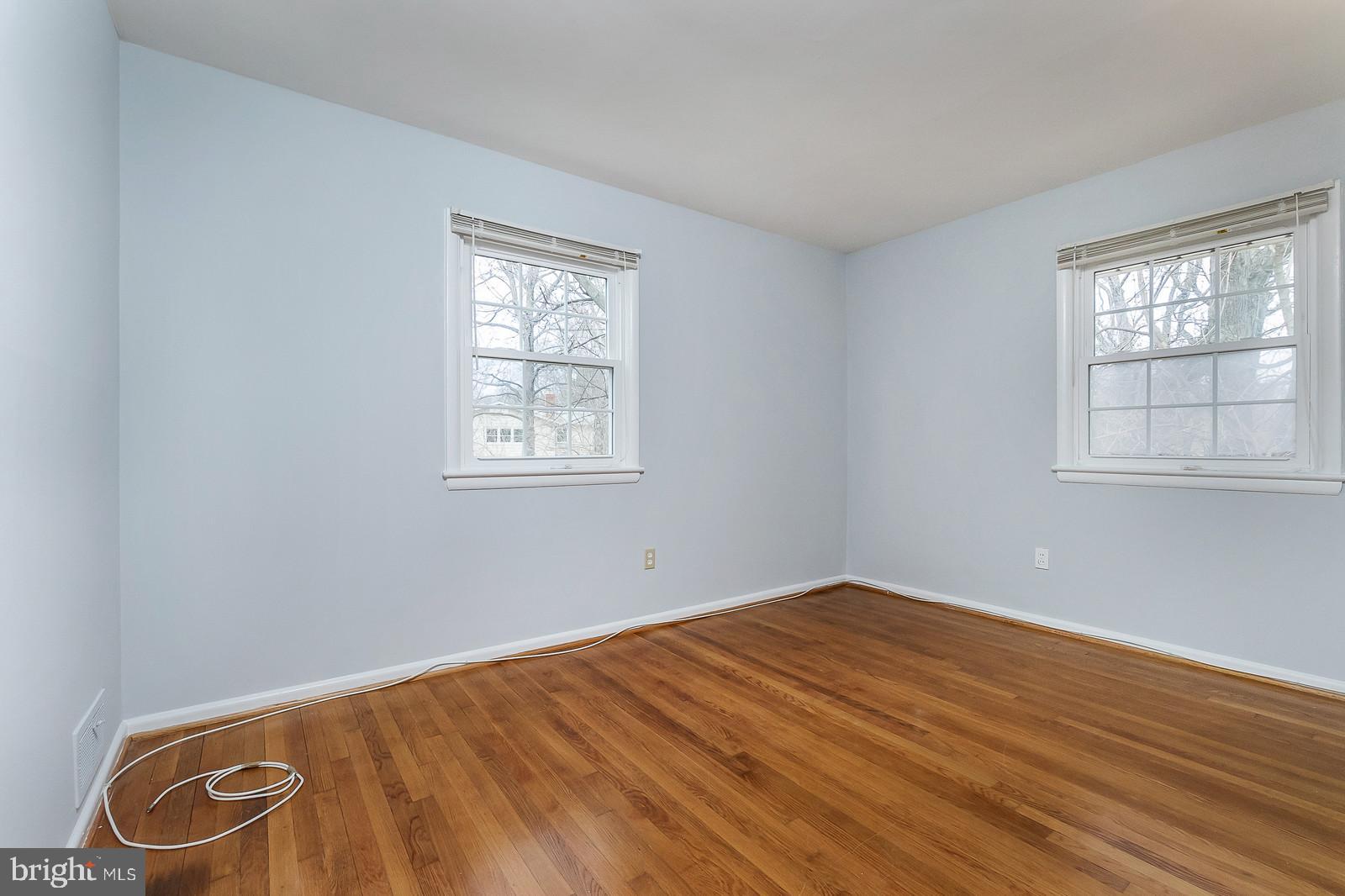409 Orleans Circle Southwest Vienna, VA 22180 - Photo 13 of 23 an empty room with windows