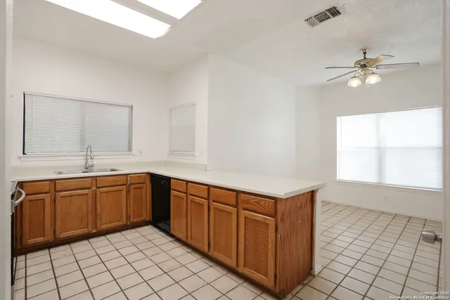 a kitchen with a sink and cabinets