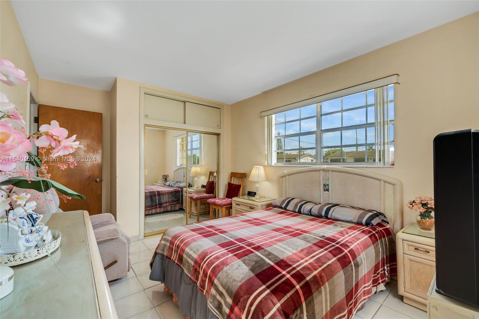 Westchester Miami, FL 33165 - Photo 14 of 30 a bedroom with a bed and a window