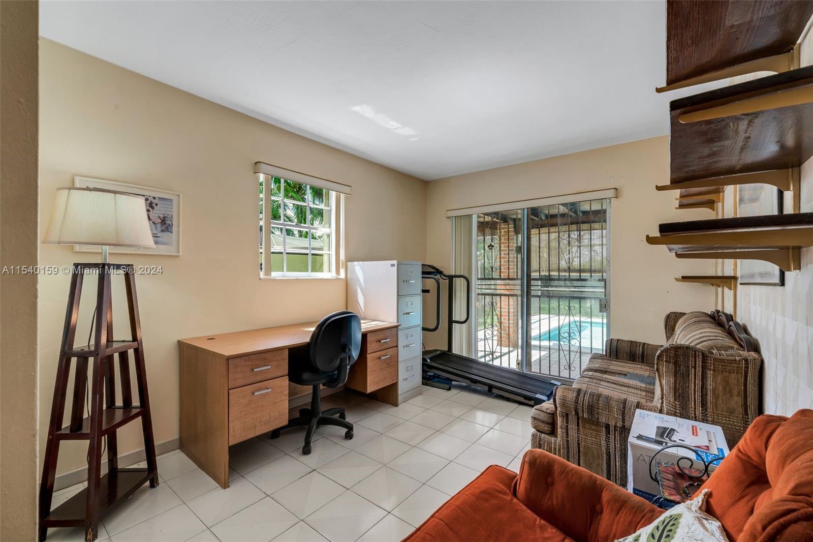 Westchester Miami, FL 33165 - Photo 15 of 30 a view of a livingroom with workspace and a window