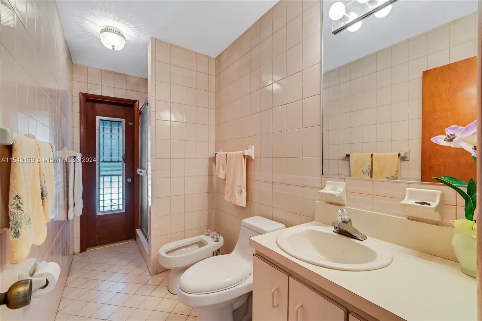 Westchester Miami, FL 33165 - Photo 16 of 30 a bathroom with a sink toilet and shower