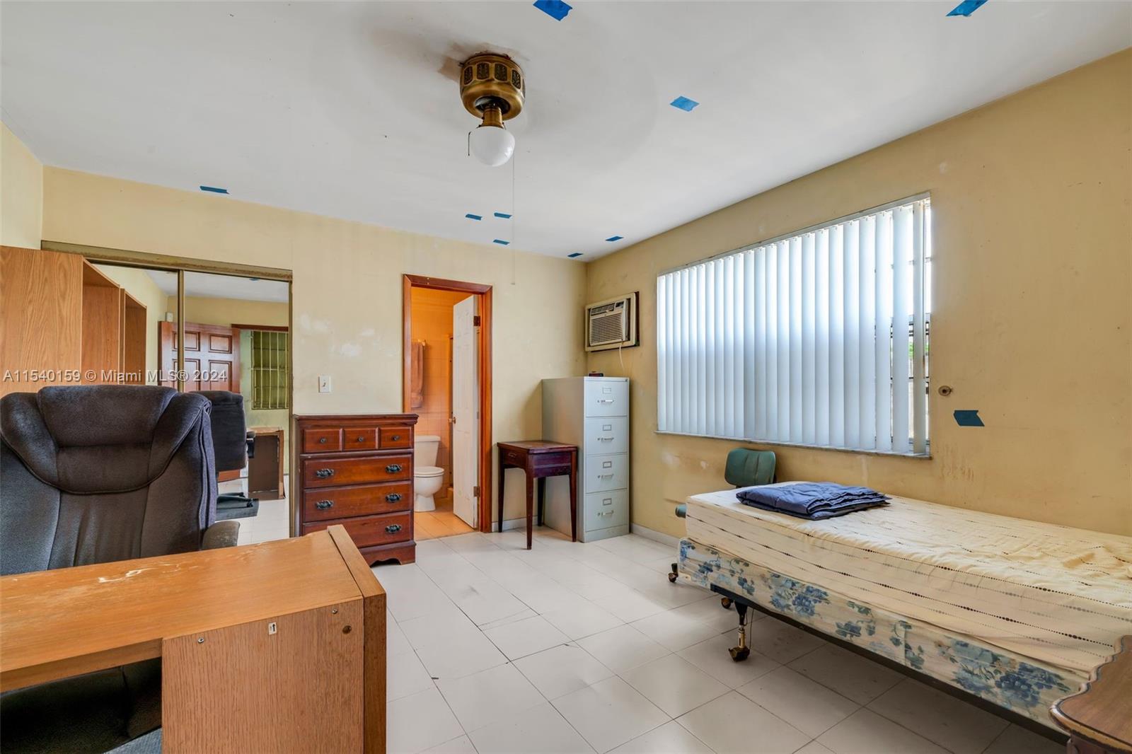 Westchester Miami, FL 33165 - Photo 25 of 30 a bedroom with furniture and a flat screen tv