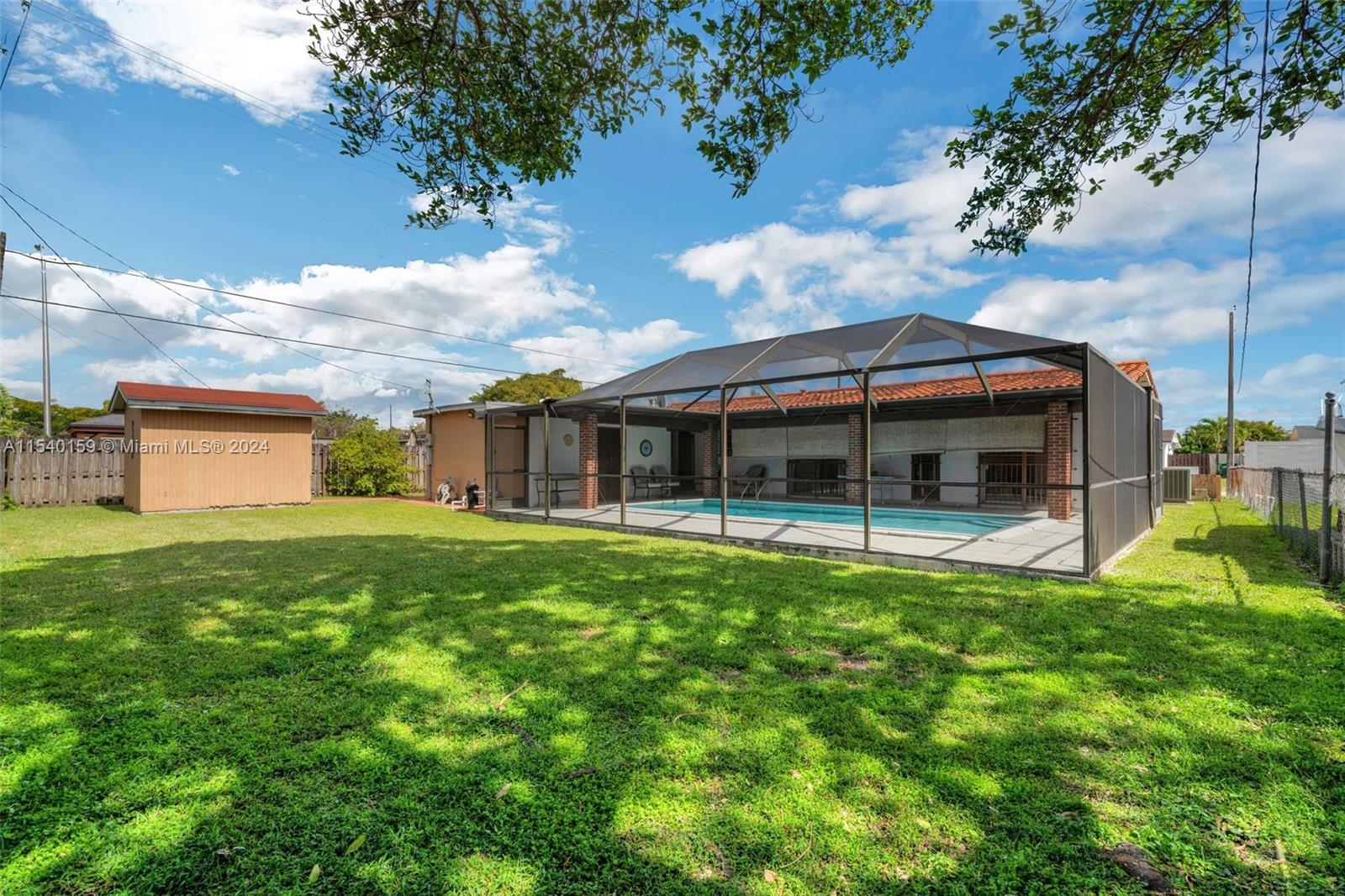 Westchester Miami, FL 33165 - Photo 27 of 30 a view of a house with a yard and sitting area