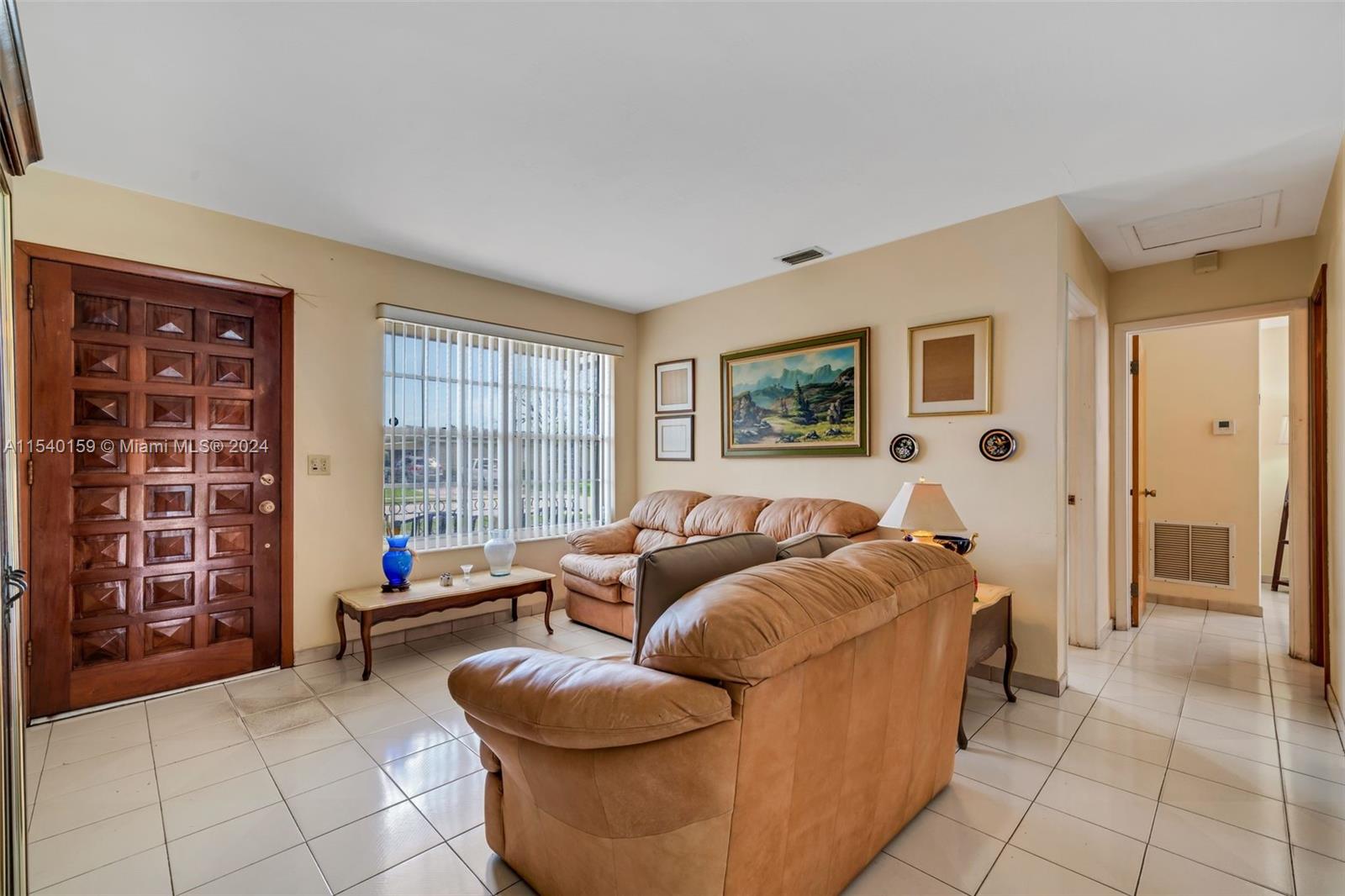 Westchester Miami, FL 33165 - Photo 6 of 30 a living room with furniture and a window