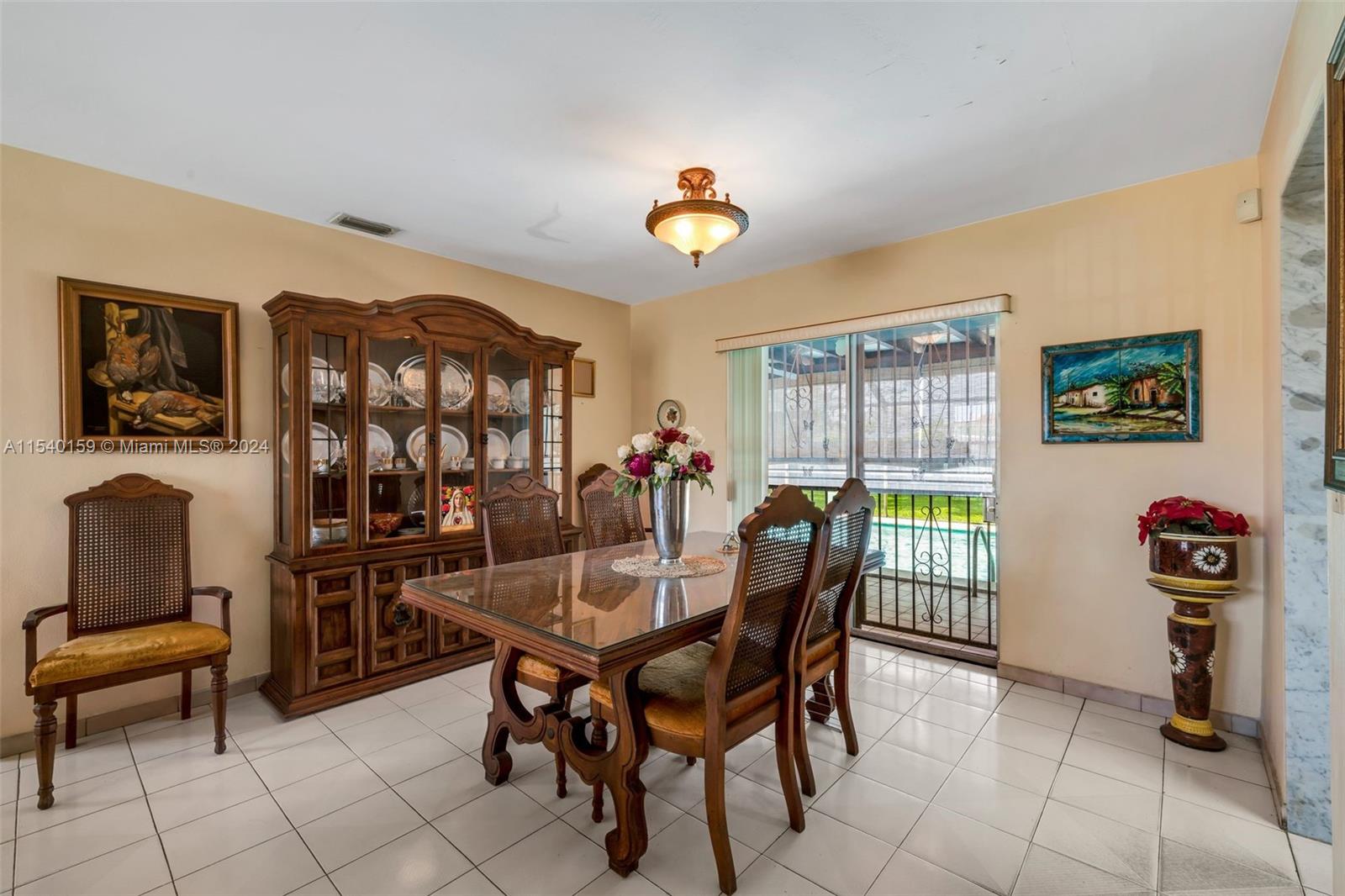 Westchester Miami, FL 33165 - Photo 8 of 30 a view of a dining room with furniture and a chandelier