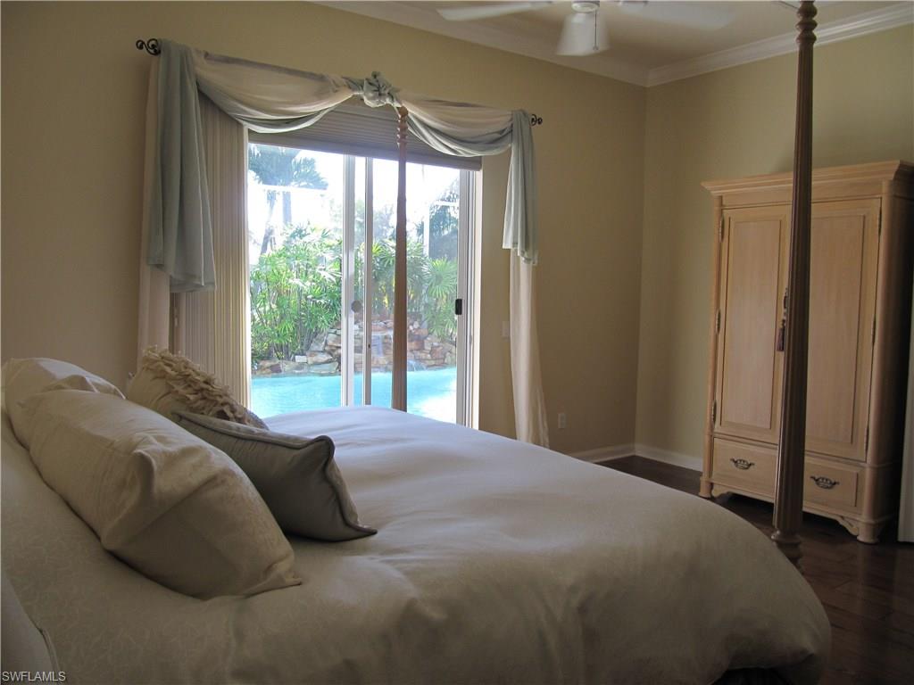 5160 Inagua Way Naples, FL 34119 - Photo 17 of 25 View of pool from master bedroom