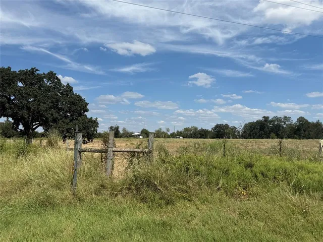 a view of a lake with houses in the back