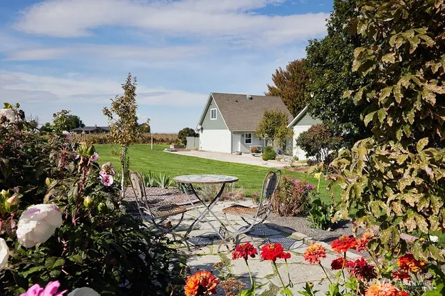 a view of yard with swimming pool and outdoor seating