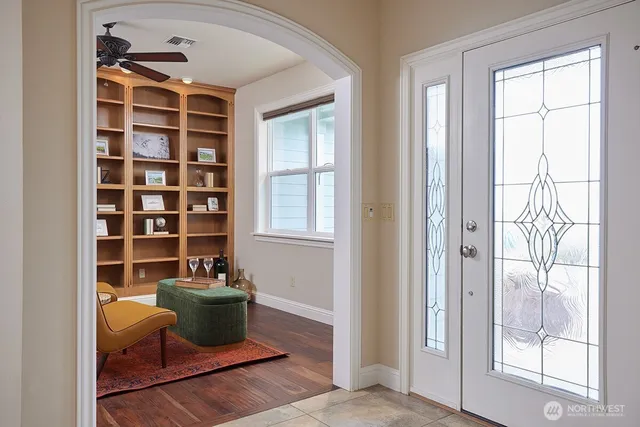 a view of an empty room and a window with outer view