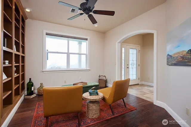 a dining room with furniture and window
