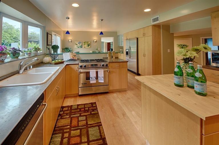 2985 Meyerloa Lane Pasadena, CA 91107 - Photo 11 of 30 a kitchen with stainless steel appliances granite countertop a sink and a refrigerator